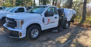 Sweeper truck at Paradise Sweeping Parking Lot Sweeping Charlotte NC