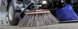 Close up of sweeper truck gutter broom.