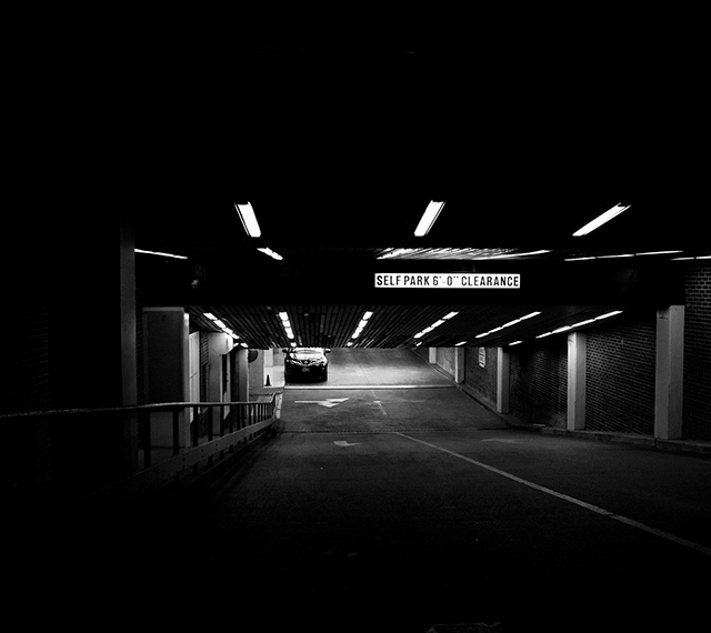 Parking garage at night with lights on