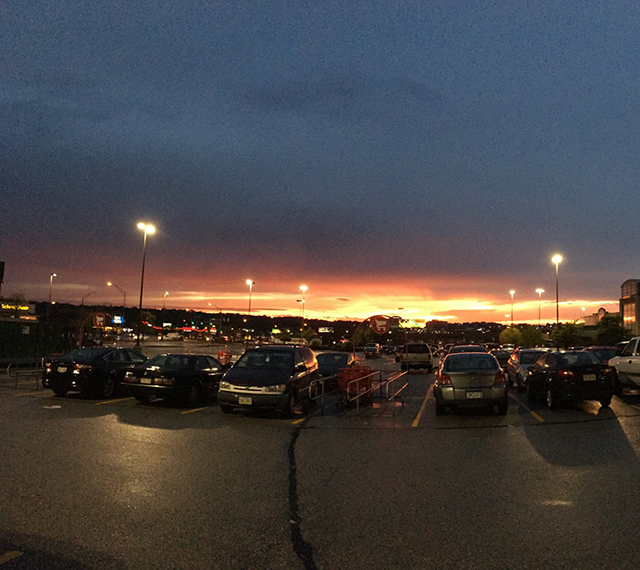 Parking lot at night with streetlights on