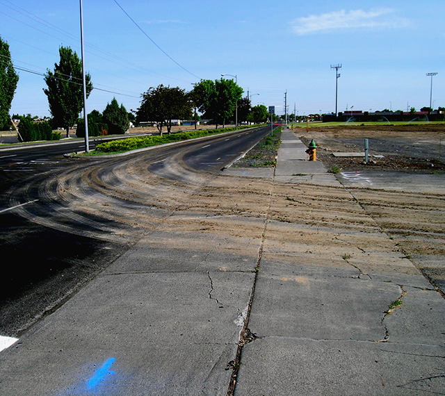 Dirt tracked out into the street from a construction site.